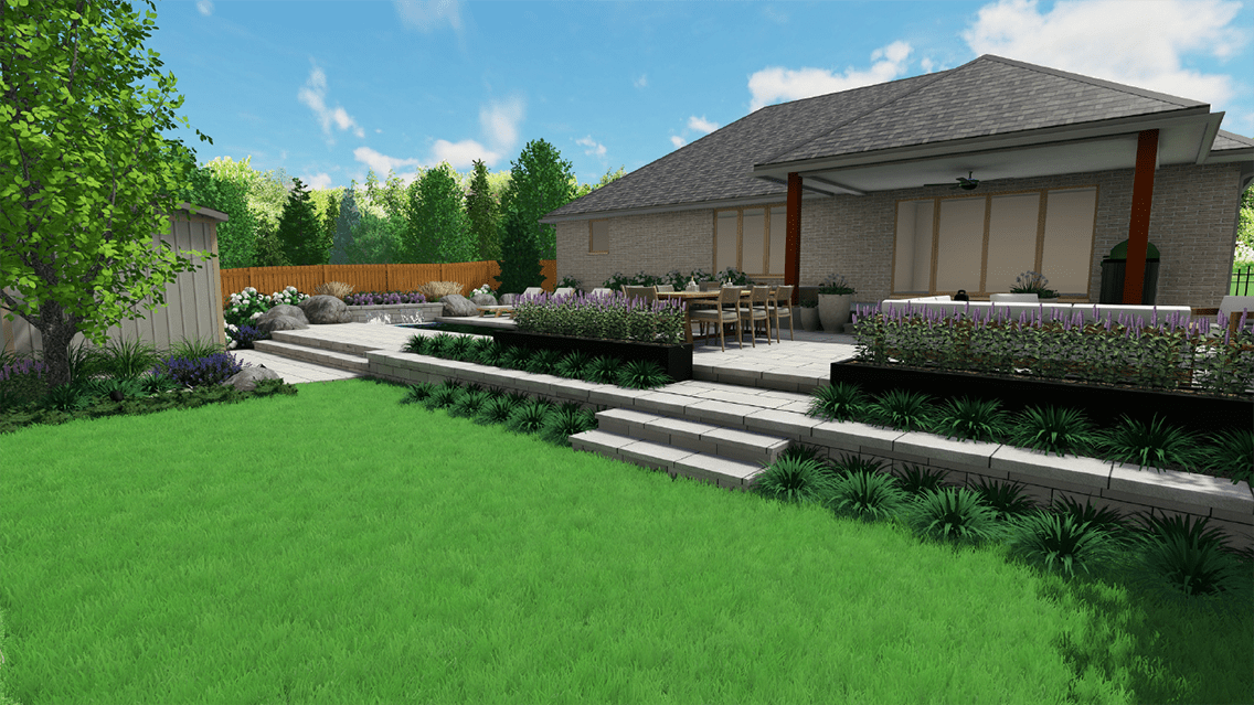 Rendered backyard design featuring a raised stone patio with wide steps leading down to a lush green lawn. The patio includes a dining table set beneath a covered porch, modern black planter beds filled with purple flowering plants, and landscaped garden beds with ornamental grasses and large accent rocks. A wooden privacy fence and mature trees frame the clean, contemporary outdoor living space.